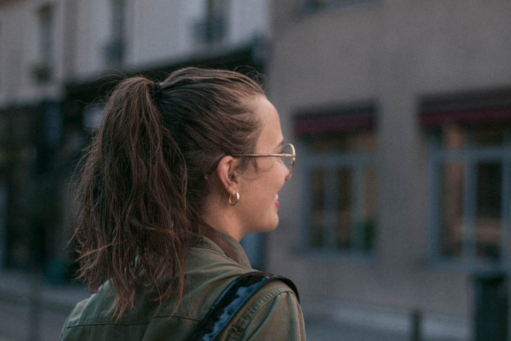 girl facing back glasses