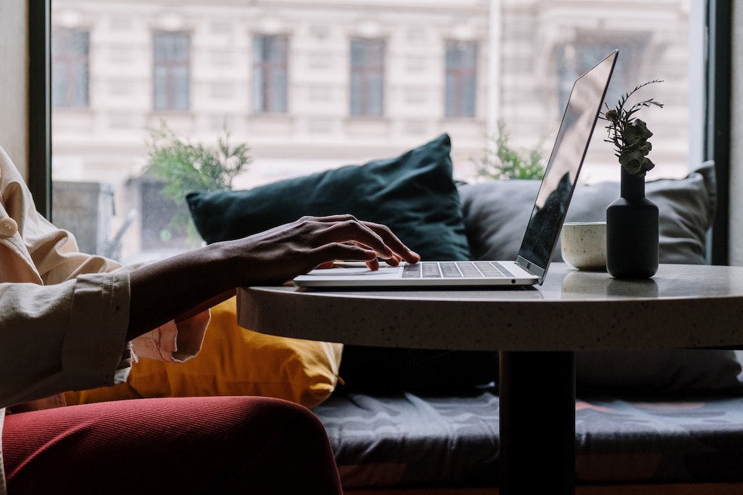 person-using-macbook-pexels-cottonbro-5054213