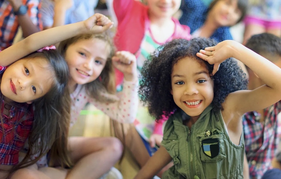 Happy diverse young school kids