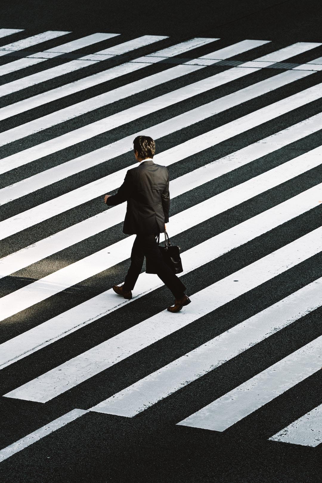 Man walking on pedestrian by Ryoji Iwata